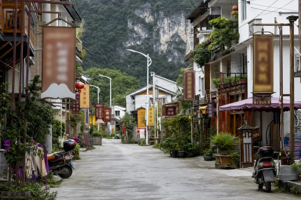 Guesthouse signage in a Moganshan village street