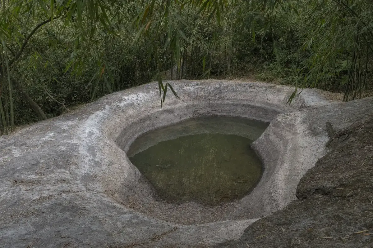Sword Pond at Moganshan at a low water level, with pale dry rock exposed around the rim