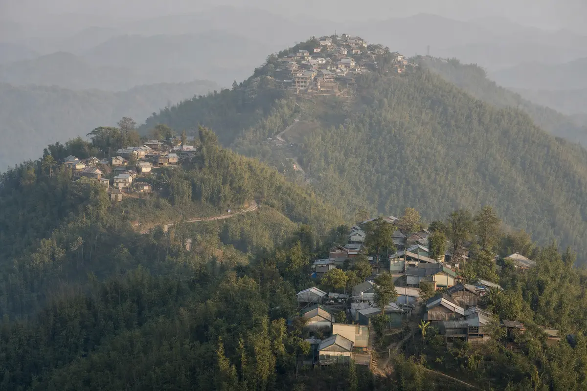 Three settlements on different shoulders of a bamboo mountain seen from a high viewpoint